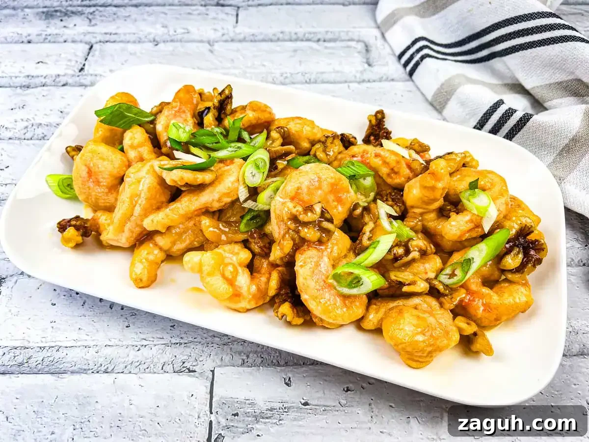 31 Bold Seafood Recipes for Big Flavor with Simple Ingredients 24 A plate of Copycat Panda Express Honey Walnut Shrimp served on a white rectangular dish.
