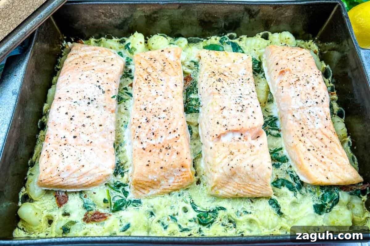 31 Bold Seafood Recipes for Big Flavor with Simple Ingredients 25 Salmon Gnocchi Bake on a casserole dish.