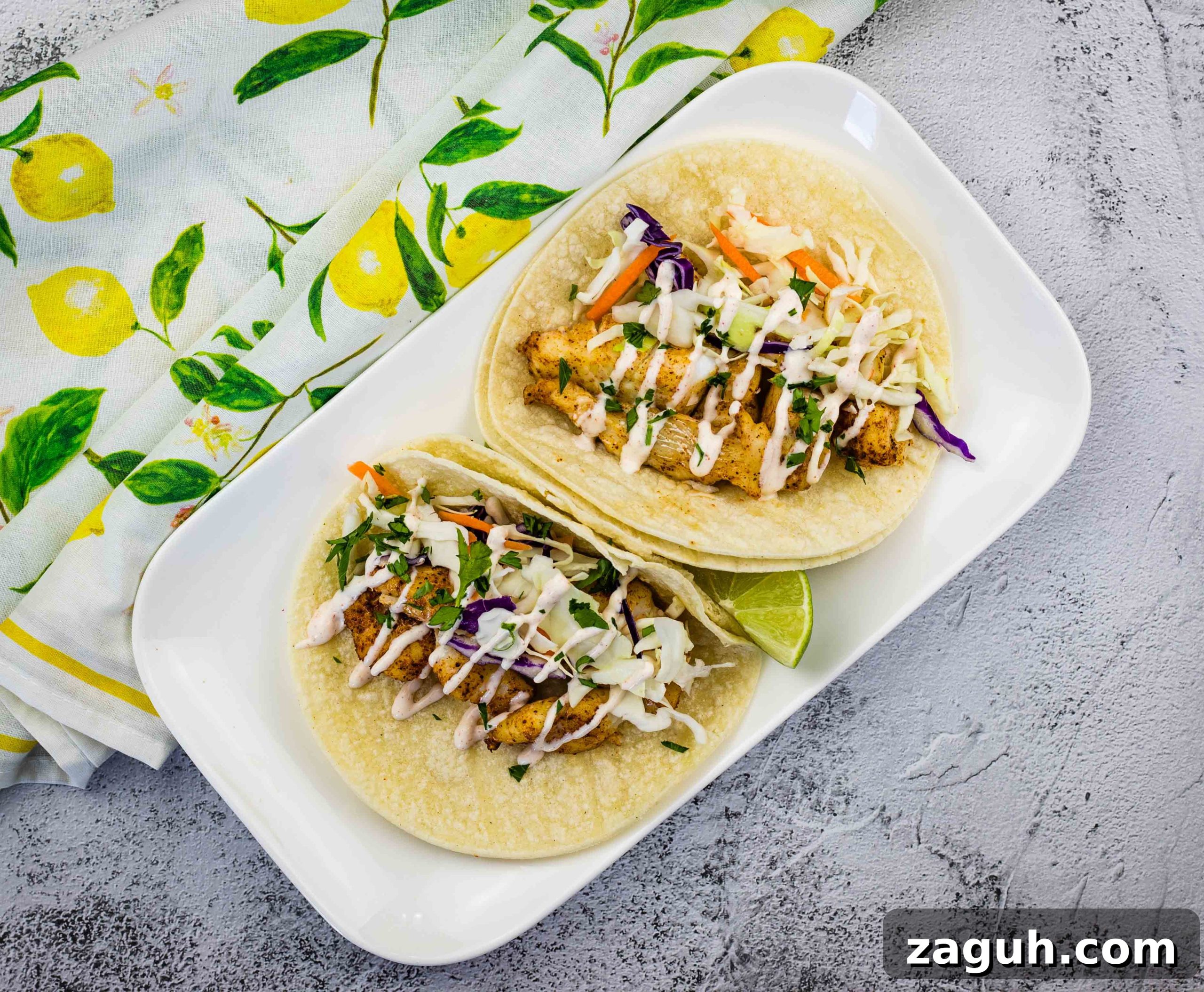 31 Bold Seafood Recipes for Big Flavor with Simple Ingredients 28 Baja fish tacos on a white plate.