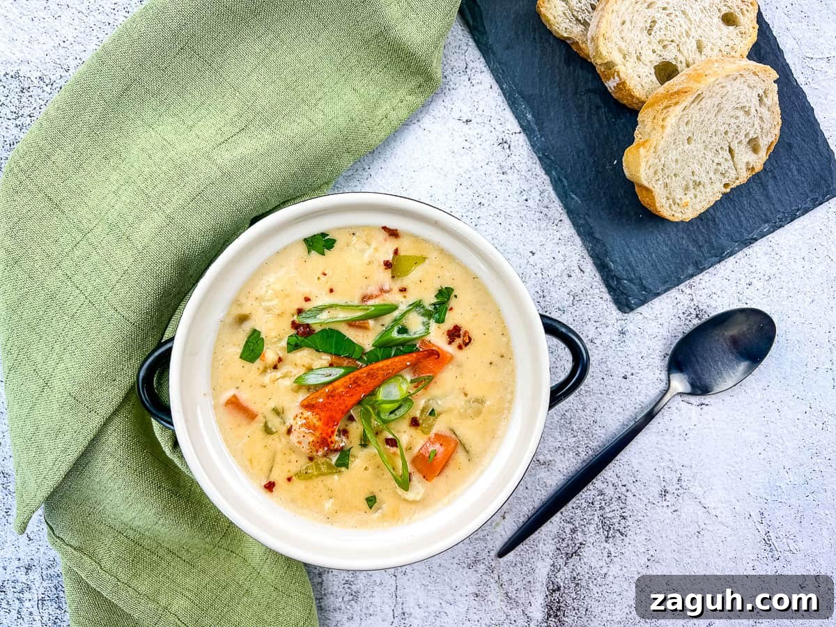 31 Bold Seafood Recipes for Big Flavor with Simple Ingredients 29 A bowl of lobster chowder with bread on the side.