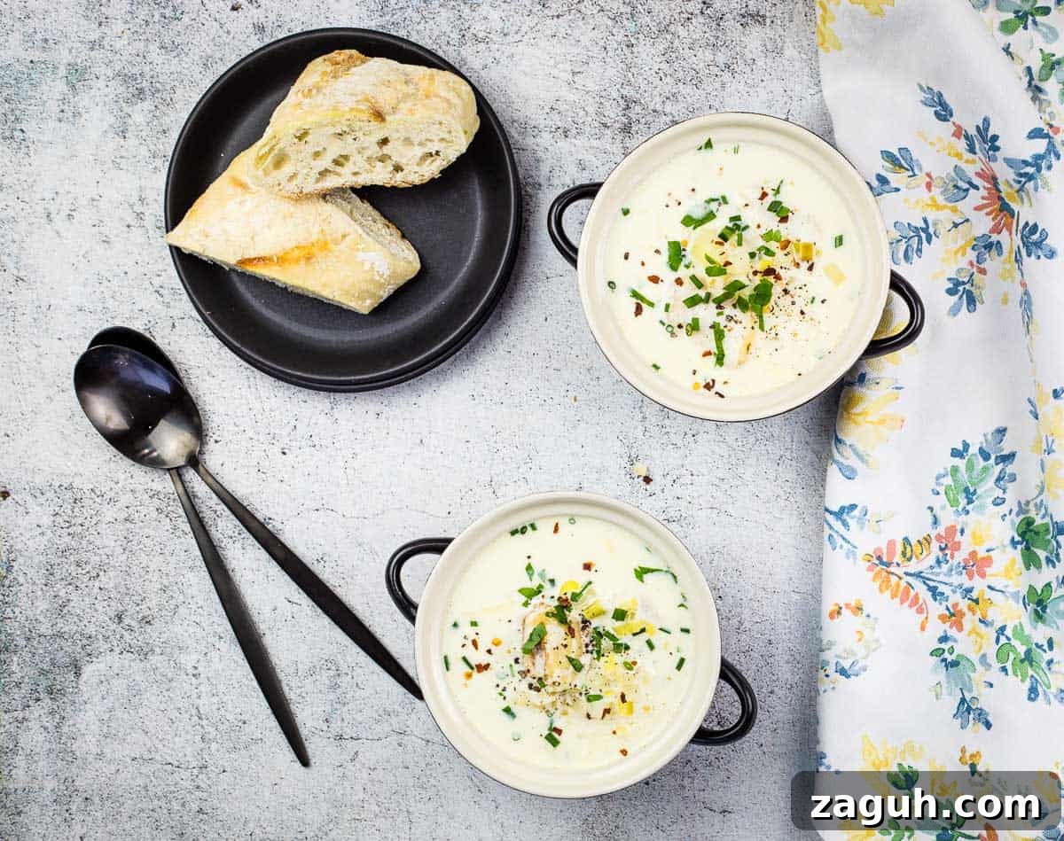 31 Bold Seafood Recipes for Big Flavor with Simple Ingredients 30 Cullen Skink in two bowls with crusty bread in the background.