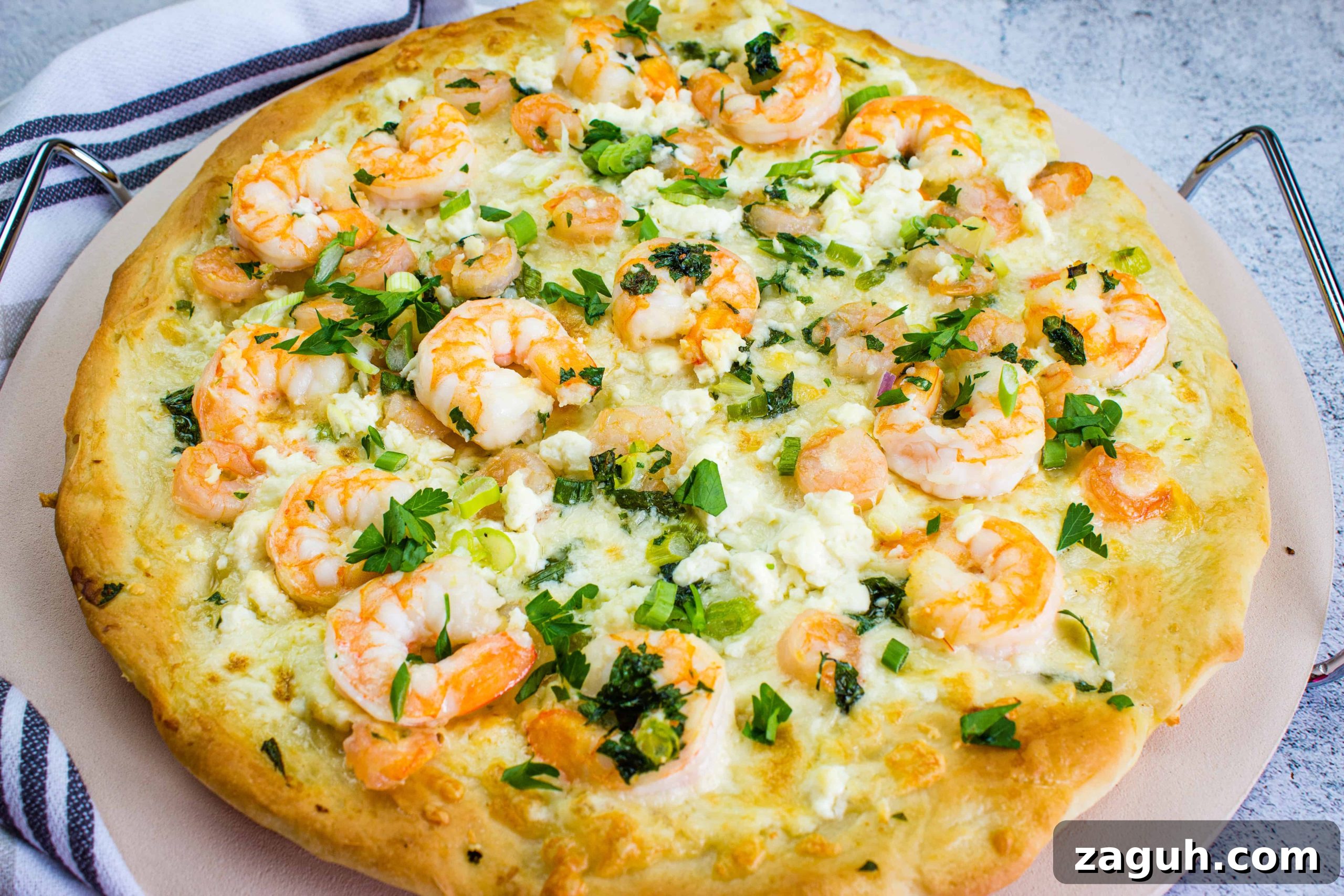 31 Bold Seafood Recipes for Big Flavor with Simple Ingredients 8 A pizza with shrimp and cheese on top.