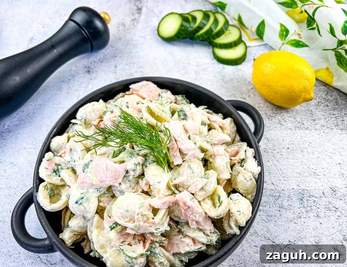 31 Bold Seafood Recipes for Big Flavor with Simple Ingredients 9 Salmon pasta salad in a black dish.