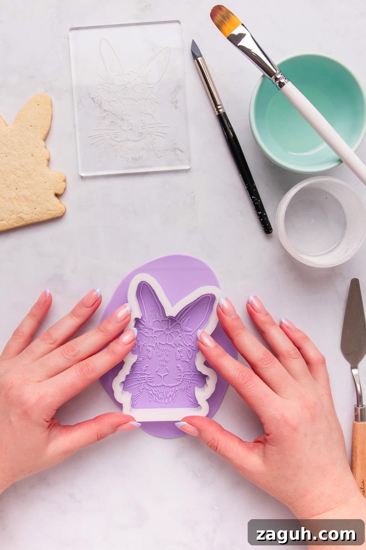 Stamped Fondant Cookies: Step-by-Step Guide for Beautiful Designs 10 Cutting out embossed fondant and placing it on a cookie.