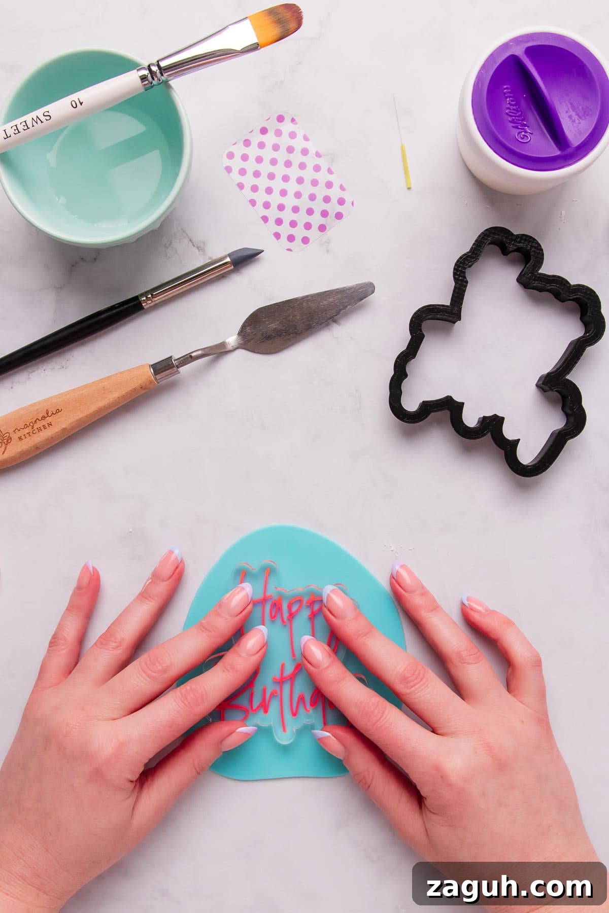Stamped Fondant Cookies: Step-by-Step Guide for Beautiful Designs 7 Pressing the fondant stamp into rolled fondant.