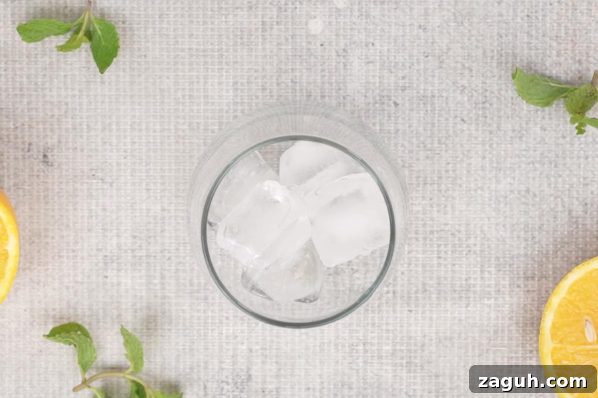 Crisp Red Wine Spritzer Recipe: Refreshing Summer Cocktail 3 Glass filled with ice cubes.