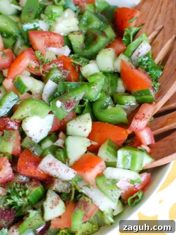 Greek Cabbage Salad Recipe with Feta and Lemon Dressing 12 Easy Lebanese Salad in white bowl with wooden spoons