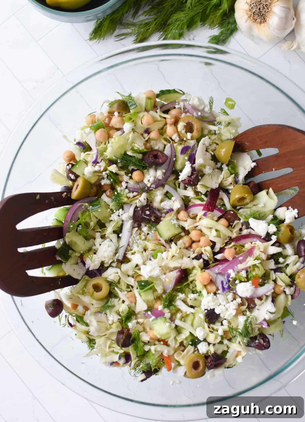 Greek Cabbage Salad Recipe with Feta and Lemon Dressing 9 Greek Cabbage Salad mixed in a bowl
