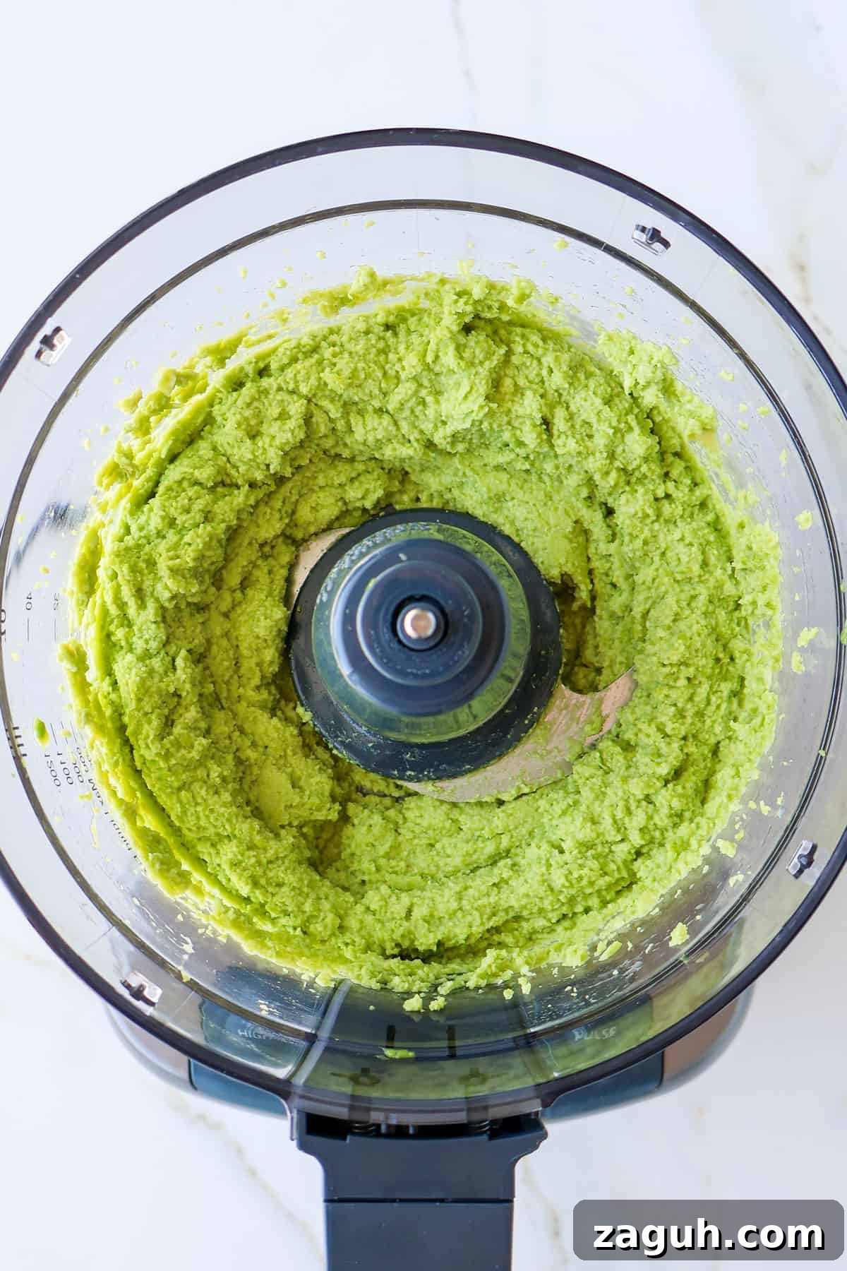 Protein-Packed Edamame Guacamole Recipe for Muscle Fuel 6 Blended edamame and avocado in a food processor.