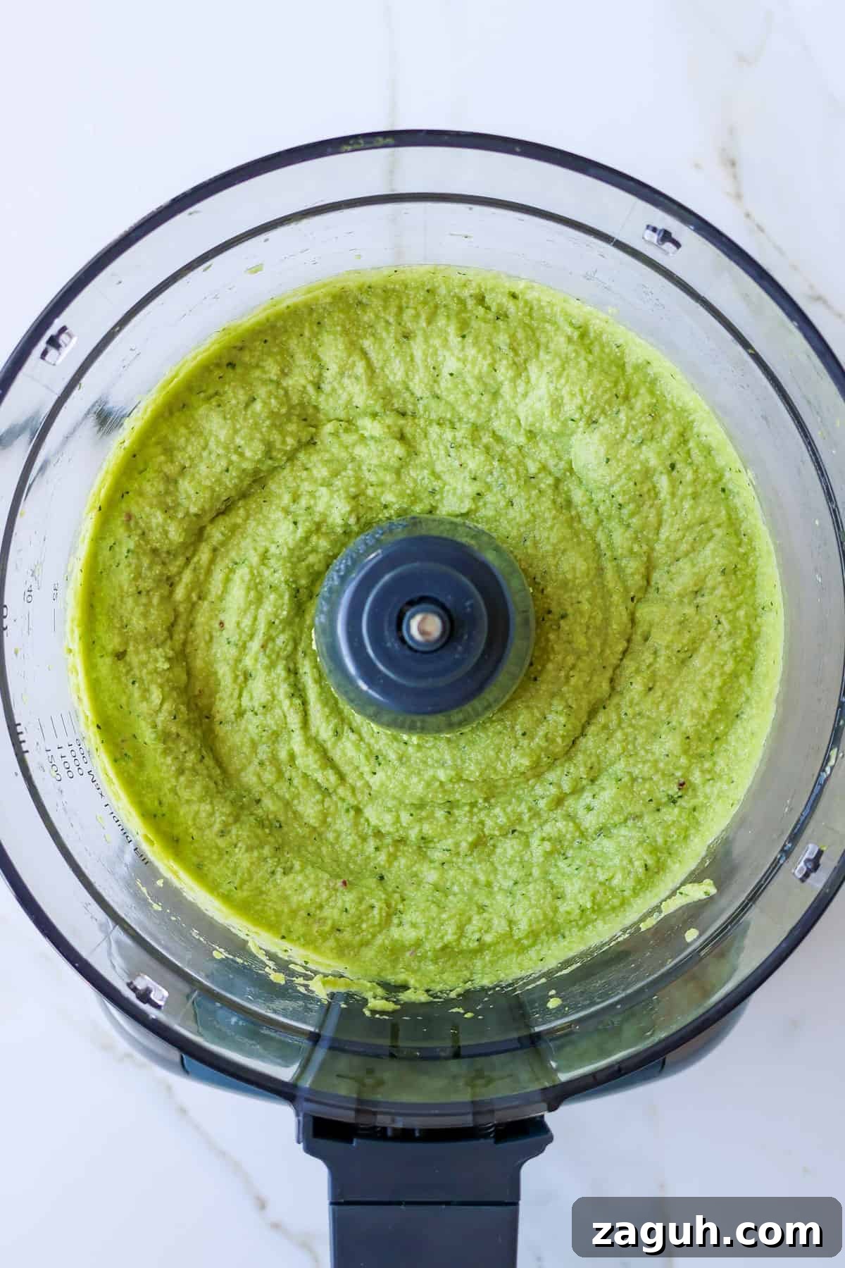 Protein-Packed Edamame Guacamole Recipe for Muscle Fuel 8 Blended guacamole in a food processor.