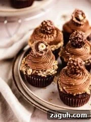 chocolate cupcakes with nutella frosting topped with ferrero rocher chocolate