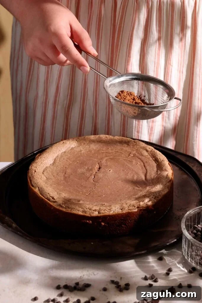 sprinkling top with cocoa powder