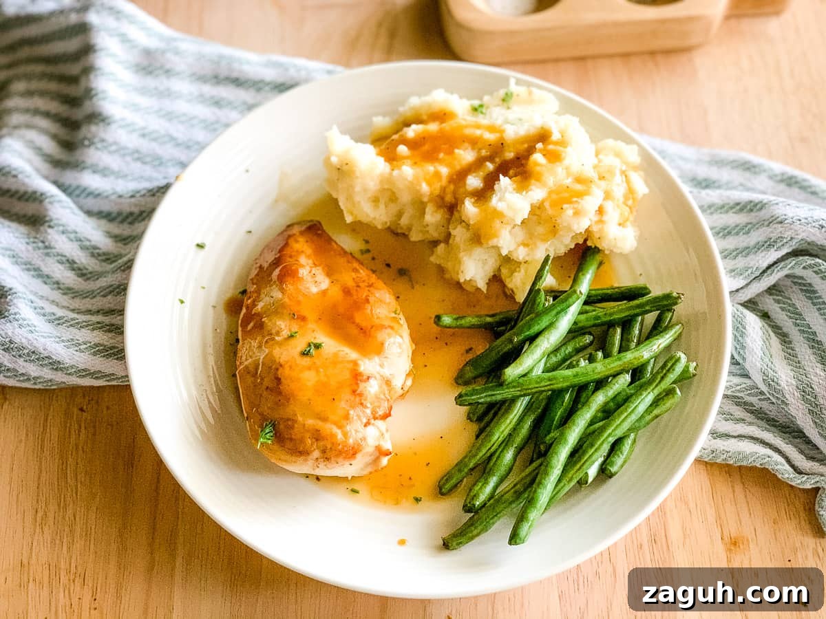 Instant Pot Mashed Potatoes Without Draining 10 Plate of mashed potatoes, green beans, and pan seared chicken with gravy.