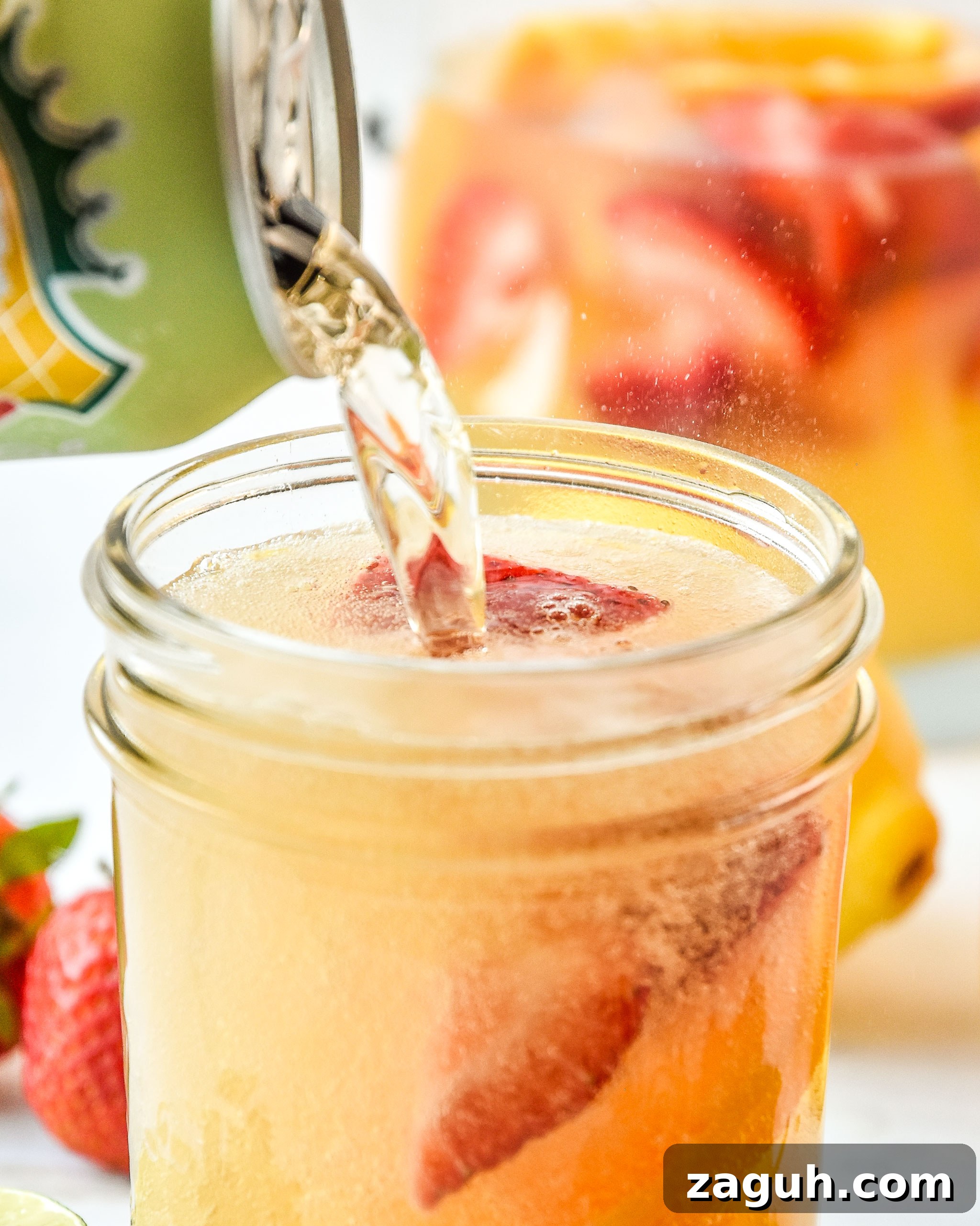 Refreshing Summer White Wine Sangria Recipe for Warm Evenings 5 Topping the summer white wine sangria with ginger ale