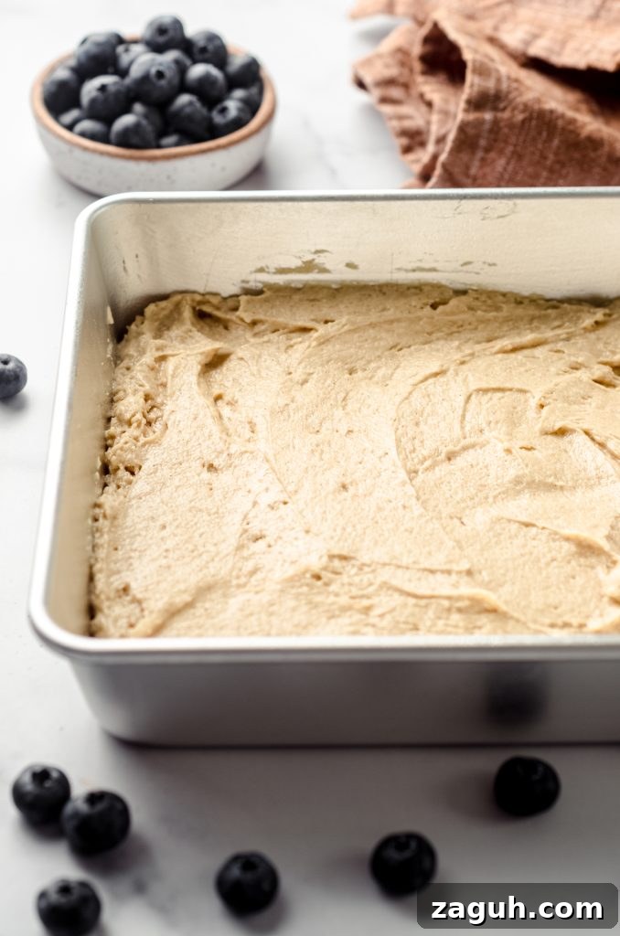 Moist Blueberry Sour Cream Coffee Cake Recipe 12 Coffee cake batter spread into a baking pan.