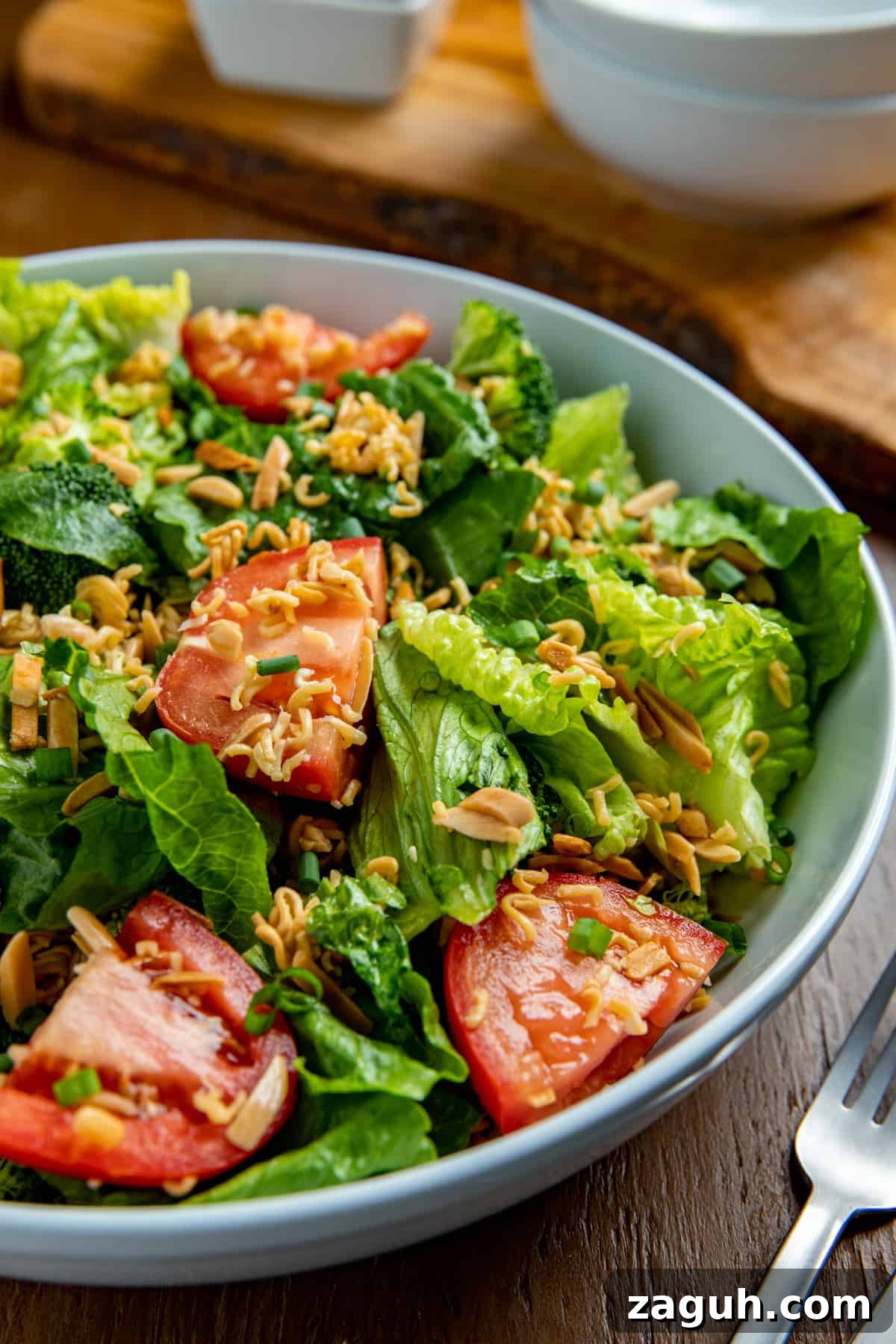 Asian Ramen Salad with Crunchy Vegetables and Sesame Dressing 2 finished salad in white bowl