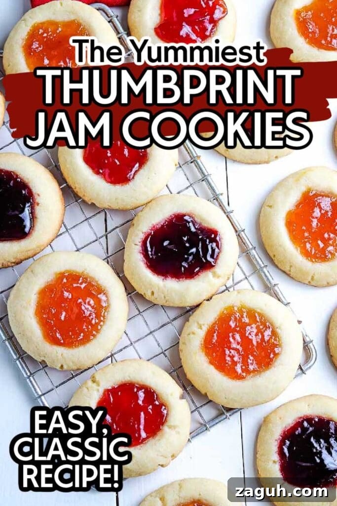 Strawberry Jam Thumbprint Cookies: Soft, Fruity Recipe 7 overhead view of cooked jam cookies on a cooling rack with text overlay.