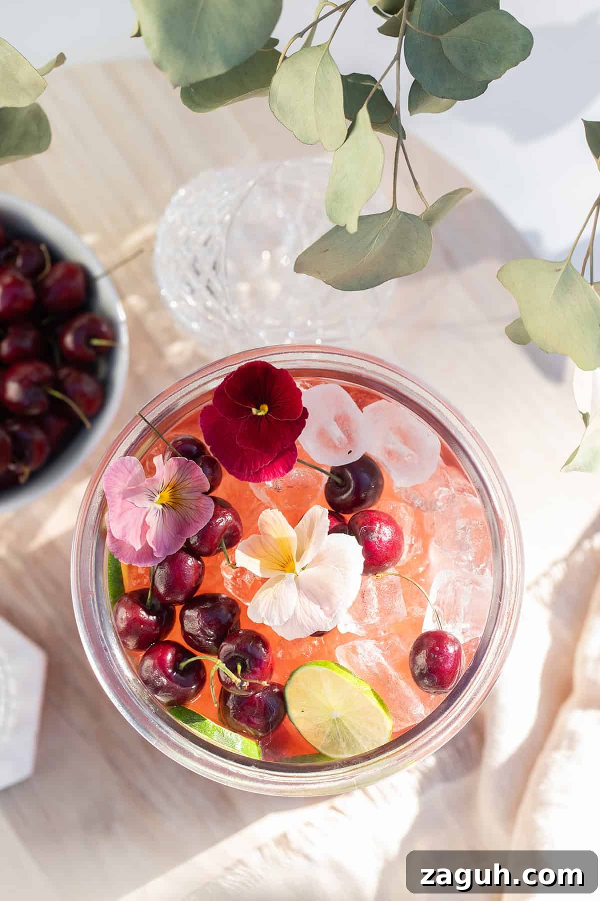 Sparkling Cherry Punch Recipe for Parties and Summer Gatherings 4 Cherry punch recipe with gin in a large glass container.