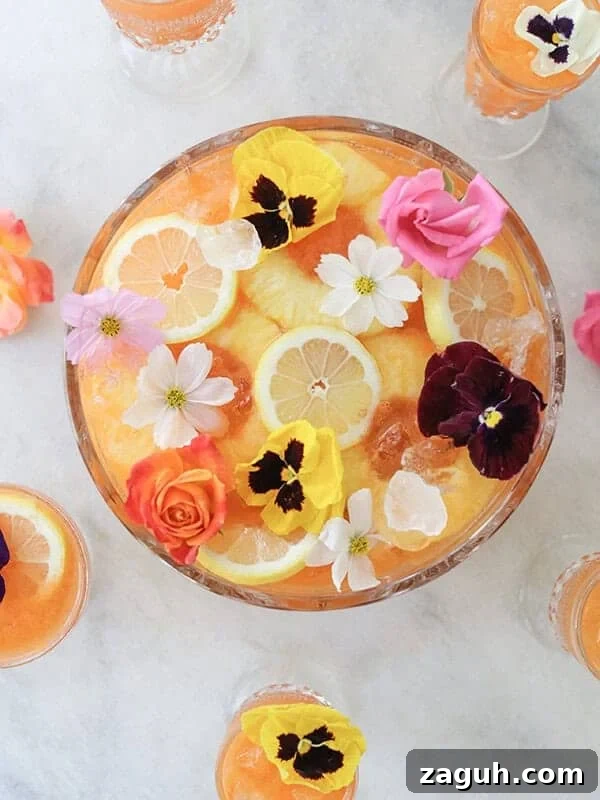 Sparkling Cherry Punch Recipe for Parties and Summer Gatherings 8 tropical pineapple party punch with edible flowers