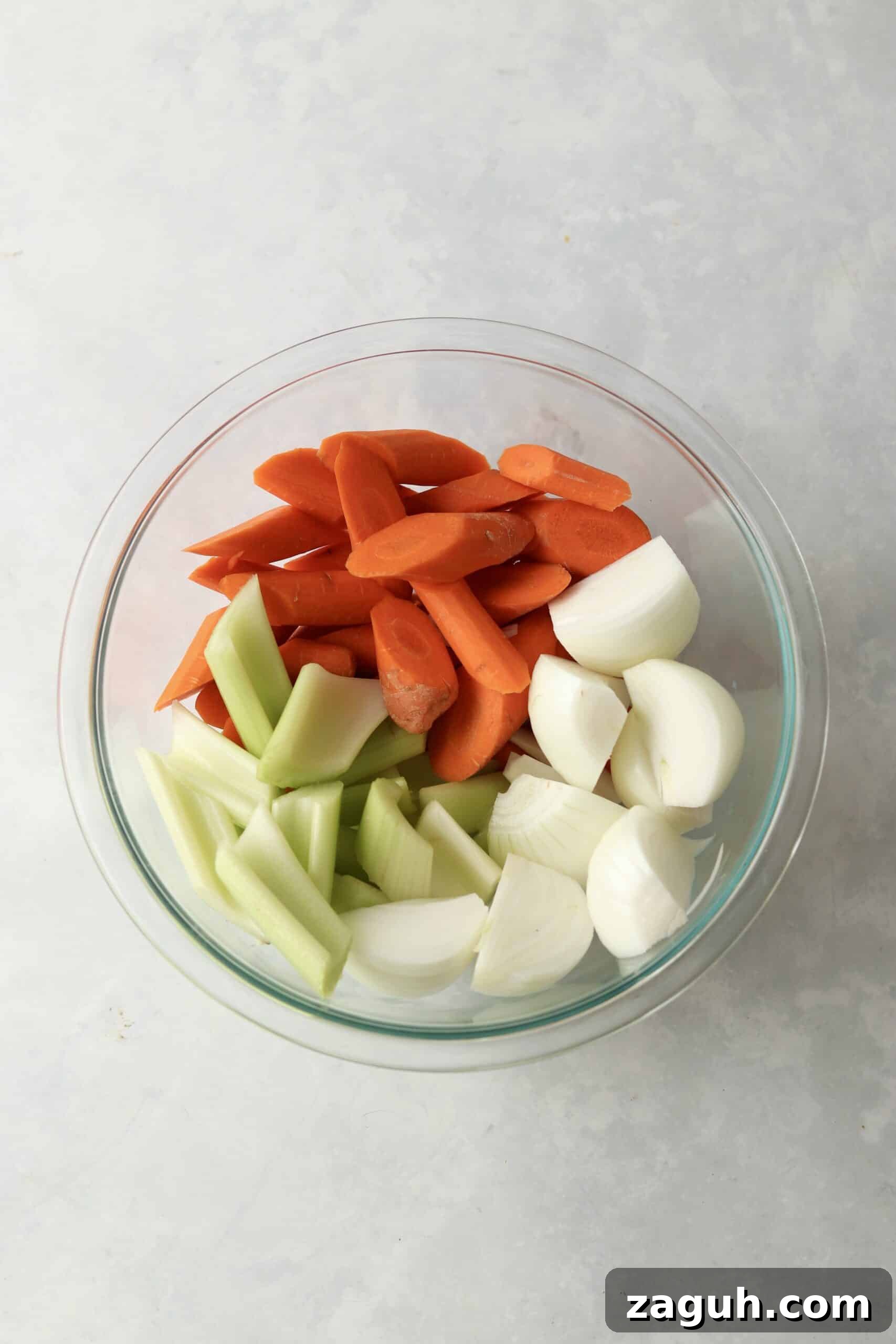 Oven-Braised Chuck Roast Recipe for Moist, Flavorful Beef 4 chopped carrots, celery, and onions in glass bowl