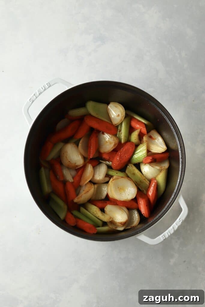 Oven-Braised Chuck Roast Recipe for Moist, Flavorful Beef 5 onion, carrots, and celery dutch oven