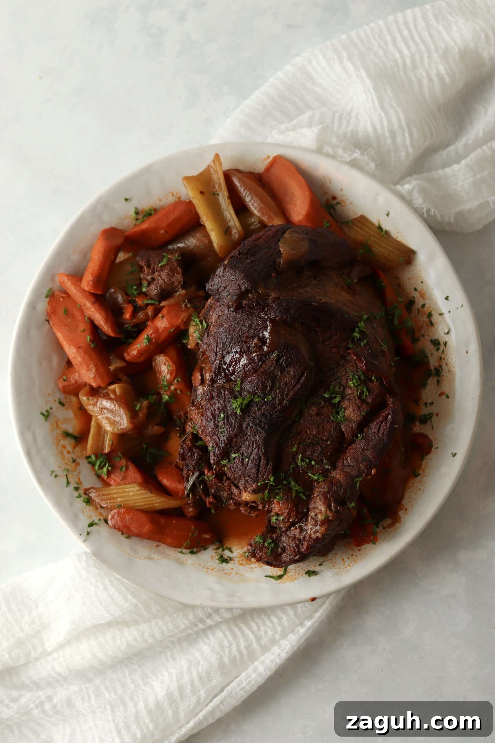 Oven-Braised Chuck Roast Recipe for Moist, Flavorful Beef 8 oven braised chuck roast on a plate