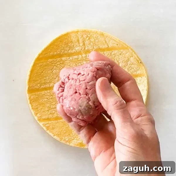 Gluten-Free Big Mac Smashed Tacos Recipe That Went Viral 7 A ball of ground beef to go on the corn tortilla.