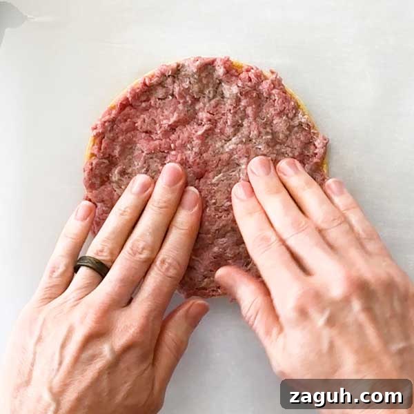 Gluten-Free Big Mac Smashed Tacos Recipe That Went Viral 8 Spreading the ground beef on the corn tortilla by hand.