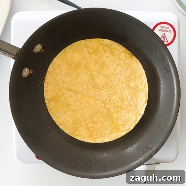 Gluten-Free Big Mac Smashed Tacos Recipe That Went Viral 10 Warming the corn tortilla in a skillet.