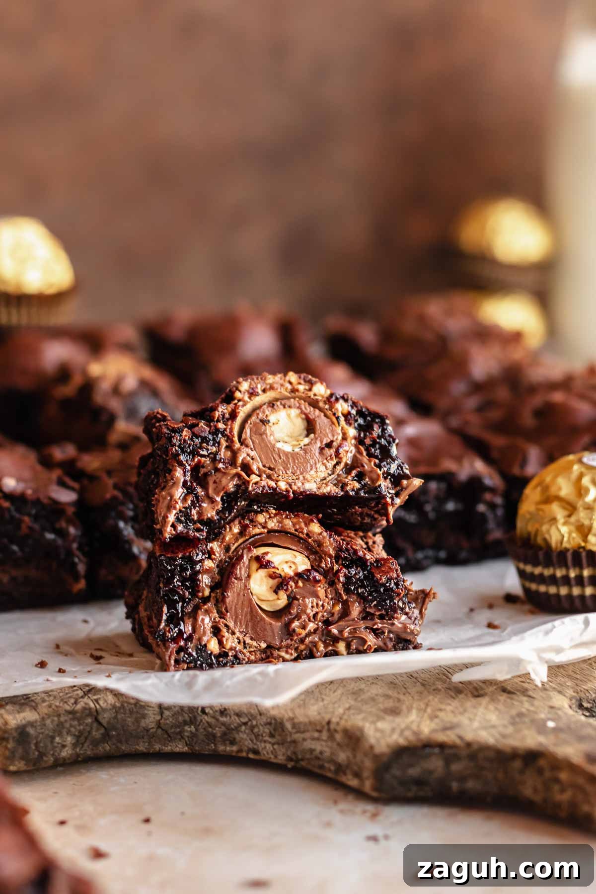 Ferrero Rocher Chocolate Brownies Recipe: Decadent Hazelnut Treat 2 Brownie split in half and stacked. The center exposes the Ferrero rocher.