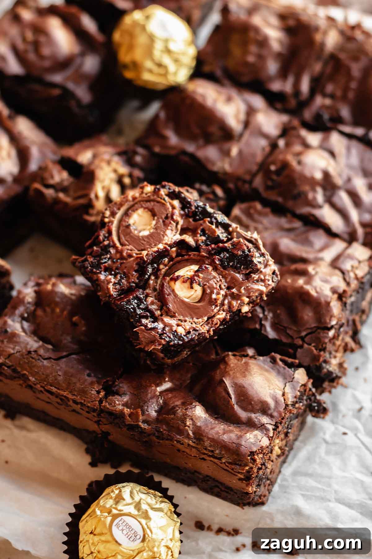 Ferrero Rocher Chocolate Brownies Recipe: Decadent Hazelnut Treat 5 Cut brownies showing Ferrero Rocher inside.