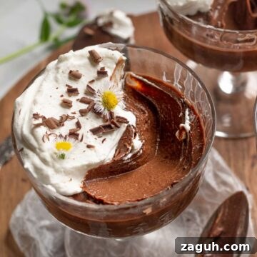 Pots de creme with a large scoop removed.