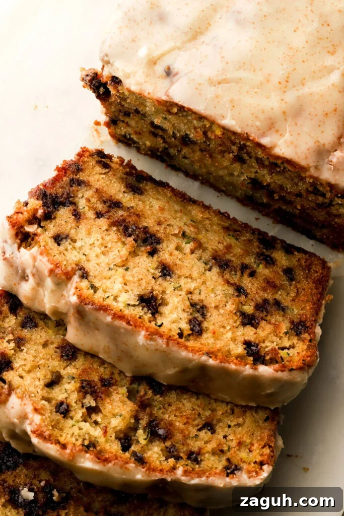 chocolate chip zucchini loaf sliced on a board