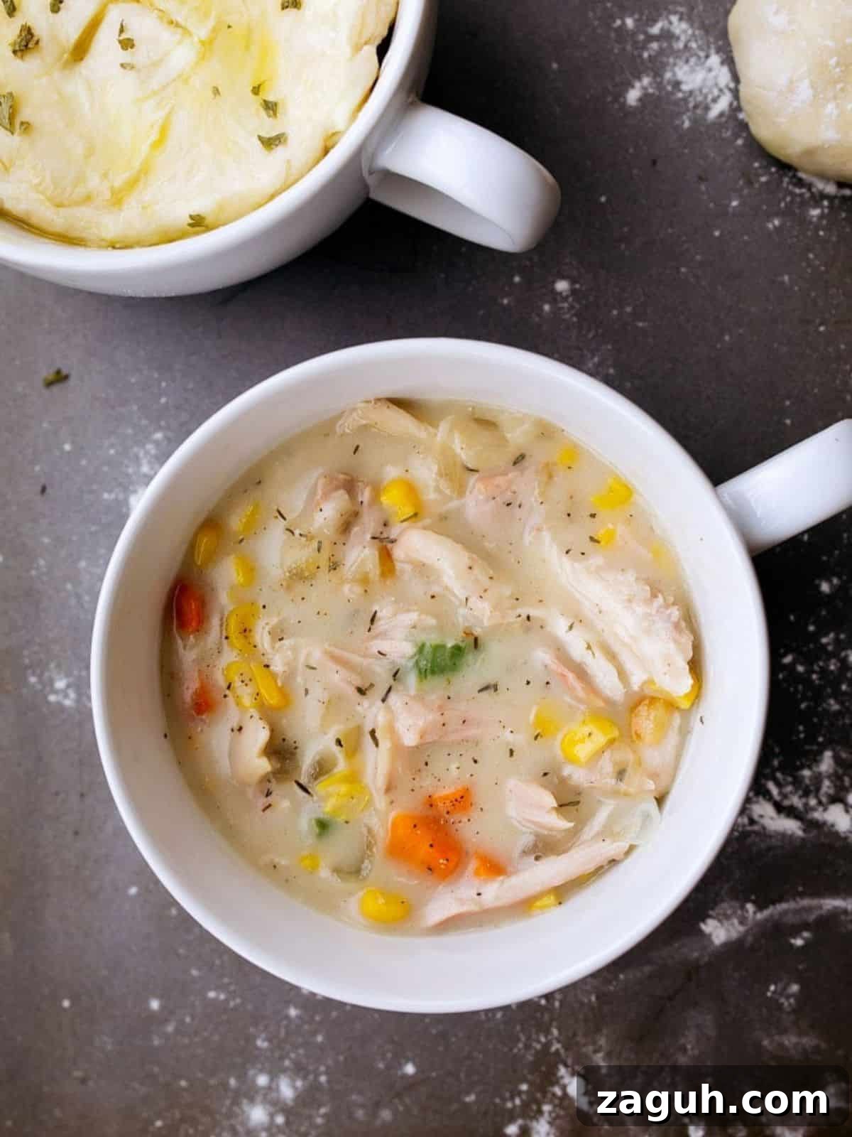 Perfect Puff Pastry Dough: Step-by-Step Homemade Recipe 11 White soup mug filled with chicken pot pie with no crust.
