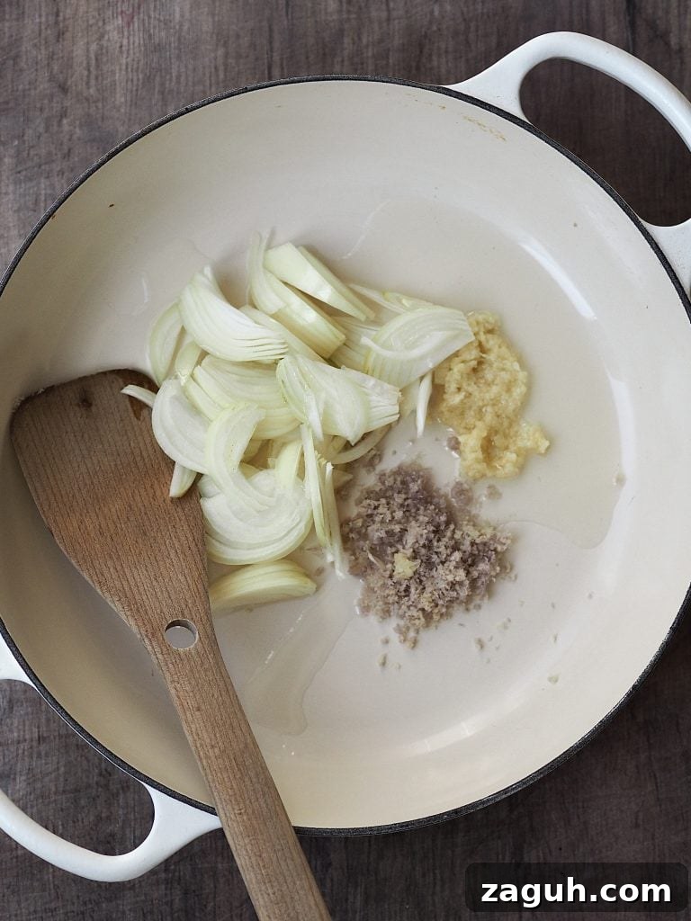 Quick Coconut Fish Curry with Lemongrass and Lime 6 Sliced onions, ginger, garlic and spices in a shallow casserole dish.